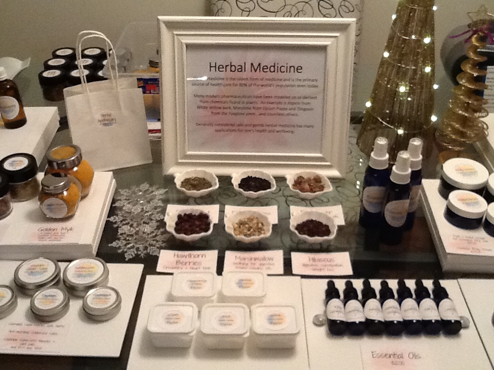 Bottles,herbs,essences, creams etc. on a table.